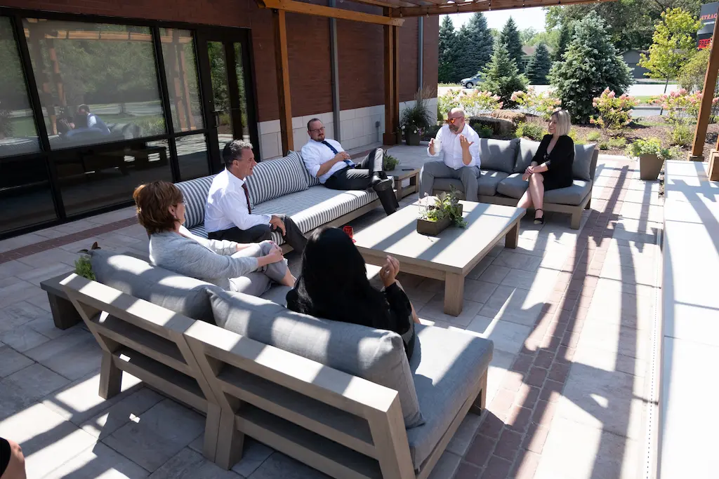 Attorneys meeting on the office patio