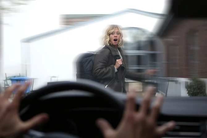 Driver about to hit a startled pedestrian