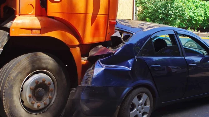 Truck that crashed into a blue car
