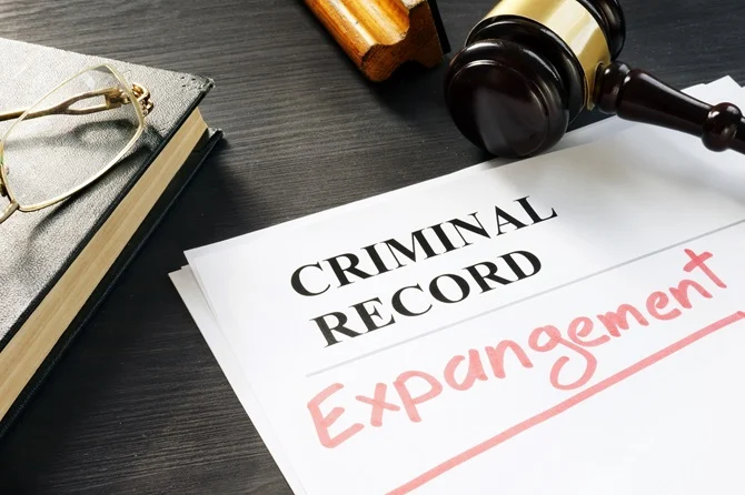 Criminal record expungement document beside a gavel