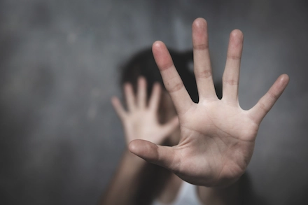Raised hand in a defensive gesture