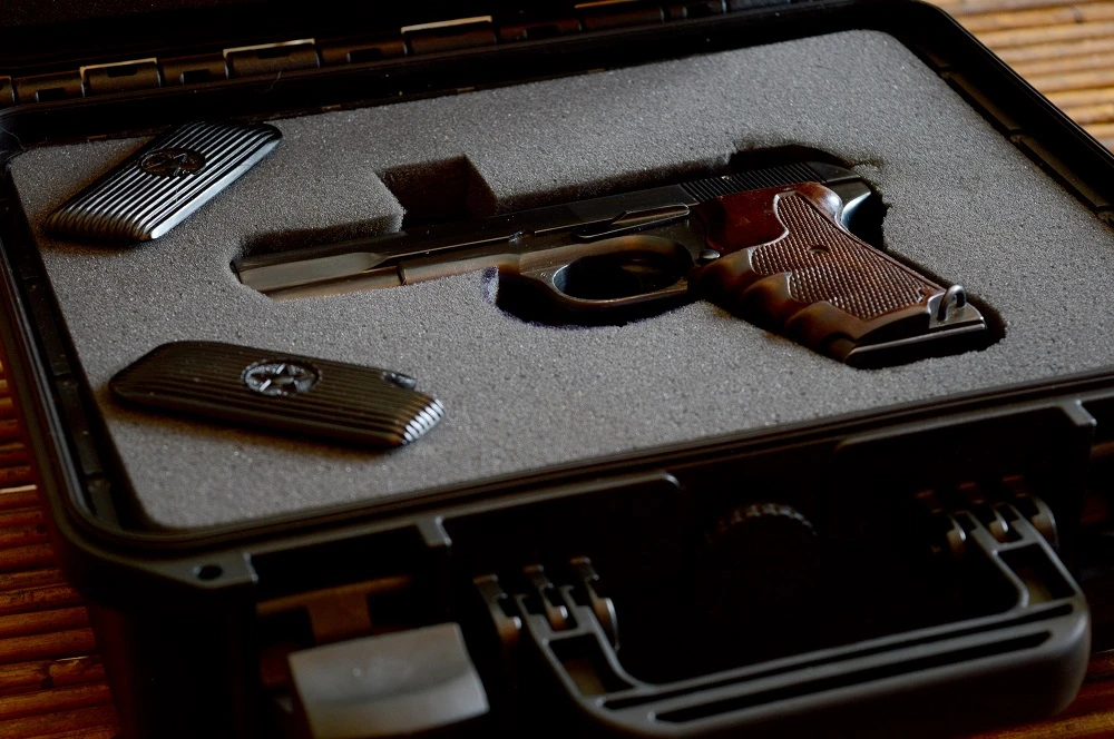 Pistol in a hard carrying case